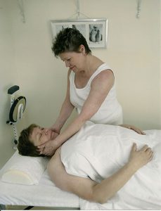 Mary performing MLD on a patient